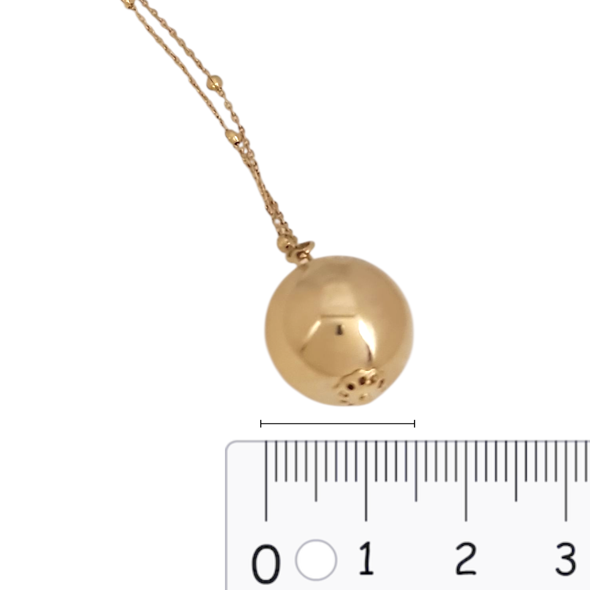 Detalle esfera collar largo oro - joya statement elegante